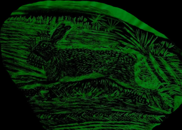 Painting on glass of Hare on snow in the moonlight